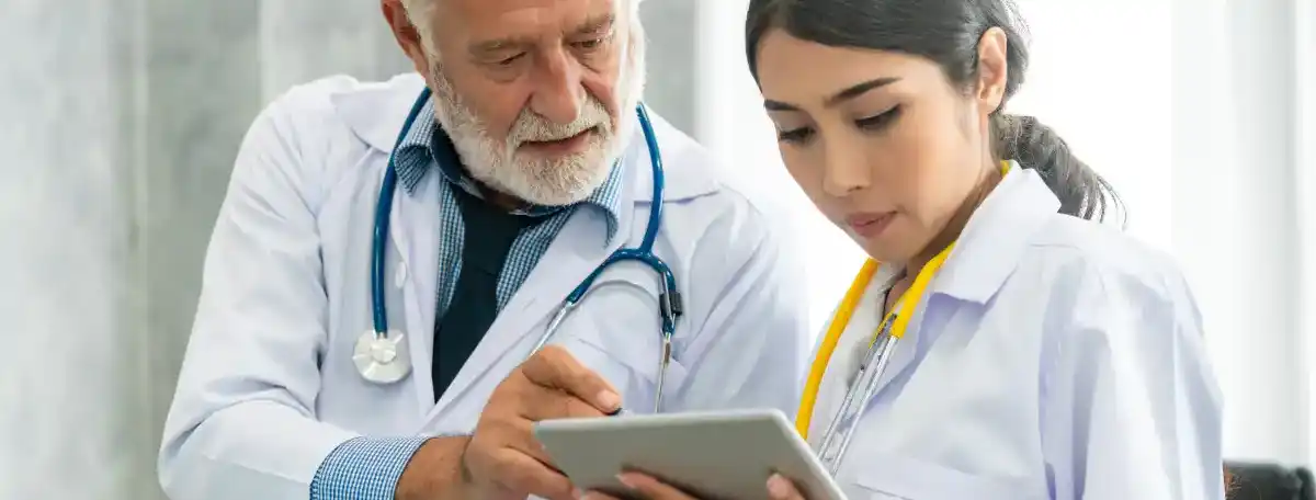 Doctors looking at tablet